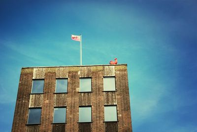 Low angle view of building against blue sky