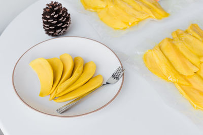 High angle view of fruits in plate on table