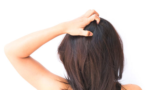 Rear view of woman against white background