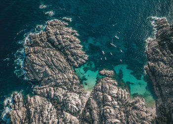 High angle view of rock formation in sea