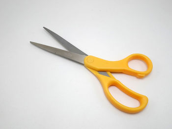 High angle view of yellow pencils on white background