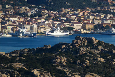Aerial view of townscape by sea