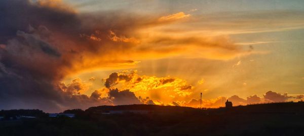 Low angle view of dramatic sky during sunset