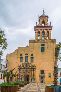 Low angle view of clock tower against sky