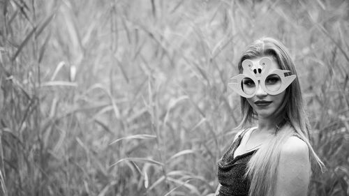 Portrait of smiling young woman on field