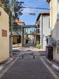 Street amidst buildings against sky