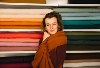 Warm and inviting fashion designer in her textile shop