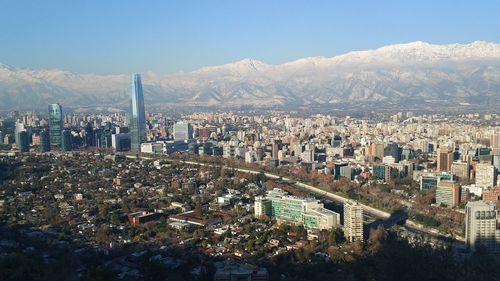 High angle view of city buildings against sky