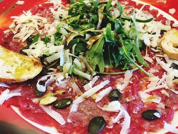 High angle view of pizza served in plate