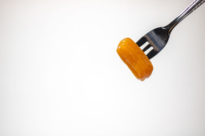 Low angle view of electric lamp against white background