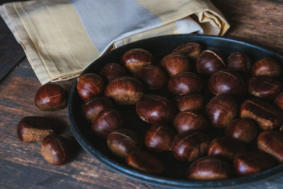 Close-up of roasted coffee beans on table