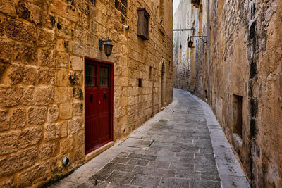 Narrow alley amidst buildings in town