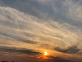 Low angle view of dramatic sky during sunset