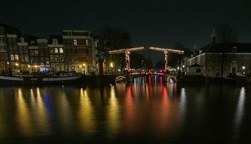 Illuminated buildings in city at night
