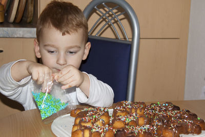 Portrait of boy looking at food