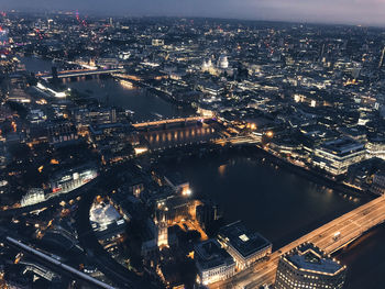 High angle view of illuminated city buildings at night