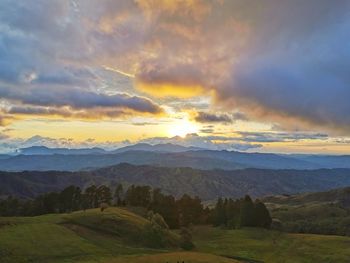 Scenic view of landscape against sky during sunset