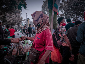 People on street in city