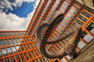 Low angle view of staircase in building against sky