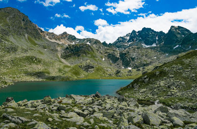 Scenic view of lake and mountains against sky