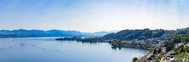 Panoramic view of sea and buildings against clear sky