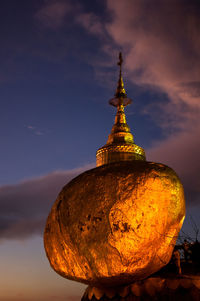 Close-up of illuminated temple against sky at sunset