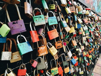 Close-up of padlocks hanging on railing