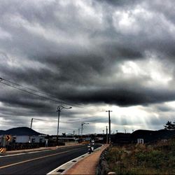 View of road against cloudy sky
