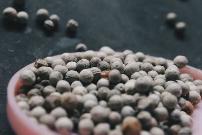 Close-up of peppercorns in bowl