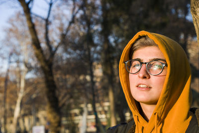 Young adult woman portrait at sunset in the park, tbilisi, georgia