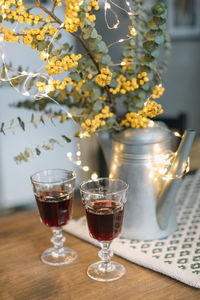 Close-up of wine glasses on table