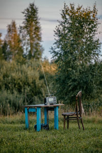 Vintage television set on table in forest
