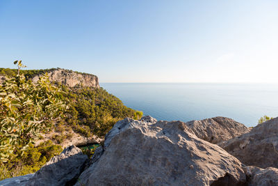 Beautiful view of the rocky mountains next to the sea in summer