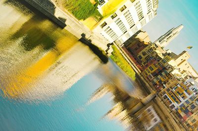 High angle view of river by buildings in city