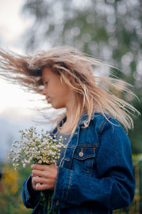 Portrait of young woman looking away