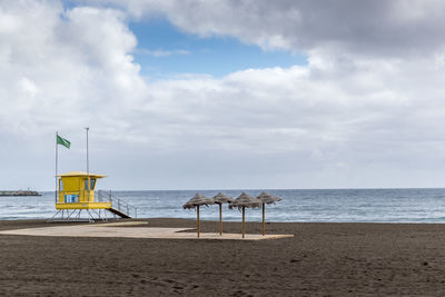 Scenic view of beach against sky
