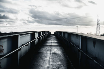 Bridge over footpath against sky