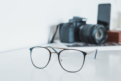 Close-up of camera on table