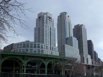 Low angle view of skyscrapers against sky