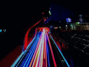 Light trails on illuminated city at night