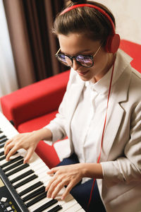 Young woman playing piano