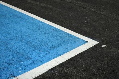 High angle view of arrow sign on road