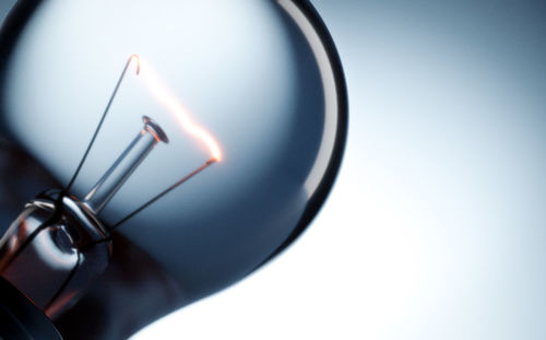 Close-up of electric lamp against white background