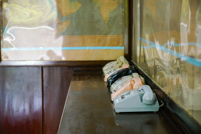 Close-up of rotary phones on table