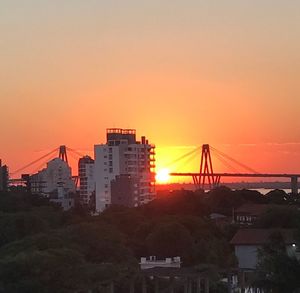 Cityscape against sky during sunset