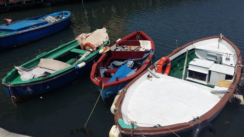 High angle view of fishing boats moored at harbor