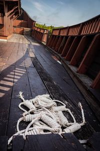 High angle view of rope tied on wood against sky