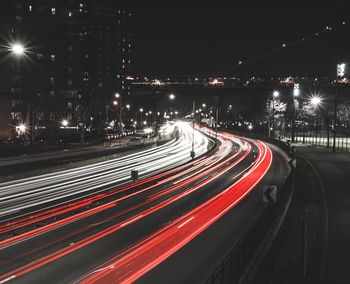 Light trails on road in city at night