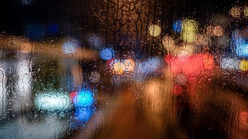 Full frame shot of wet window in rainy season