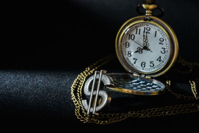 Close-up of clock on table